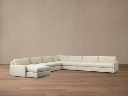 Kipton Slim Arm Five-Piece Chaise Sectional, cream fabric, L-shaped with a left-facing chaise on a wooden floor.