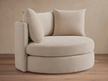 Kipton Oversized Swivel Chair in beige fabric, featuring a round seat, two plush back cushions, and a high backrest.