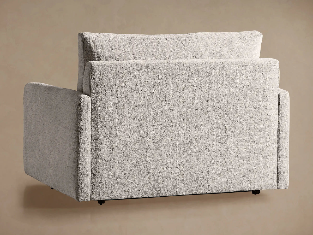 Kipton Slim Arm Chair in light grey textured fabric. Front-right view showing slim arms, plush seat, and back cushions.