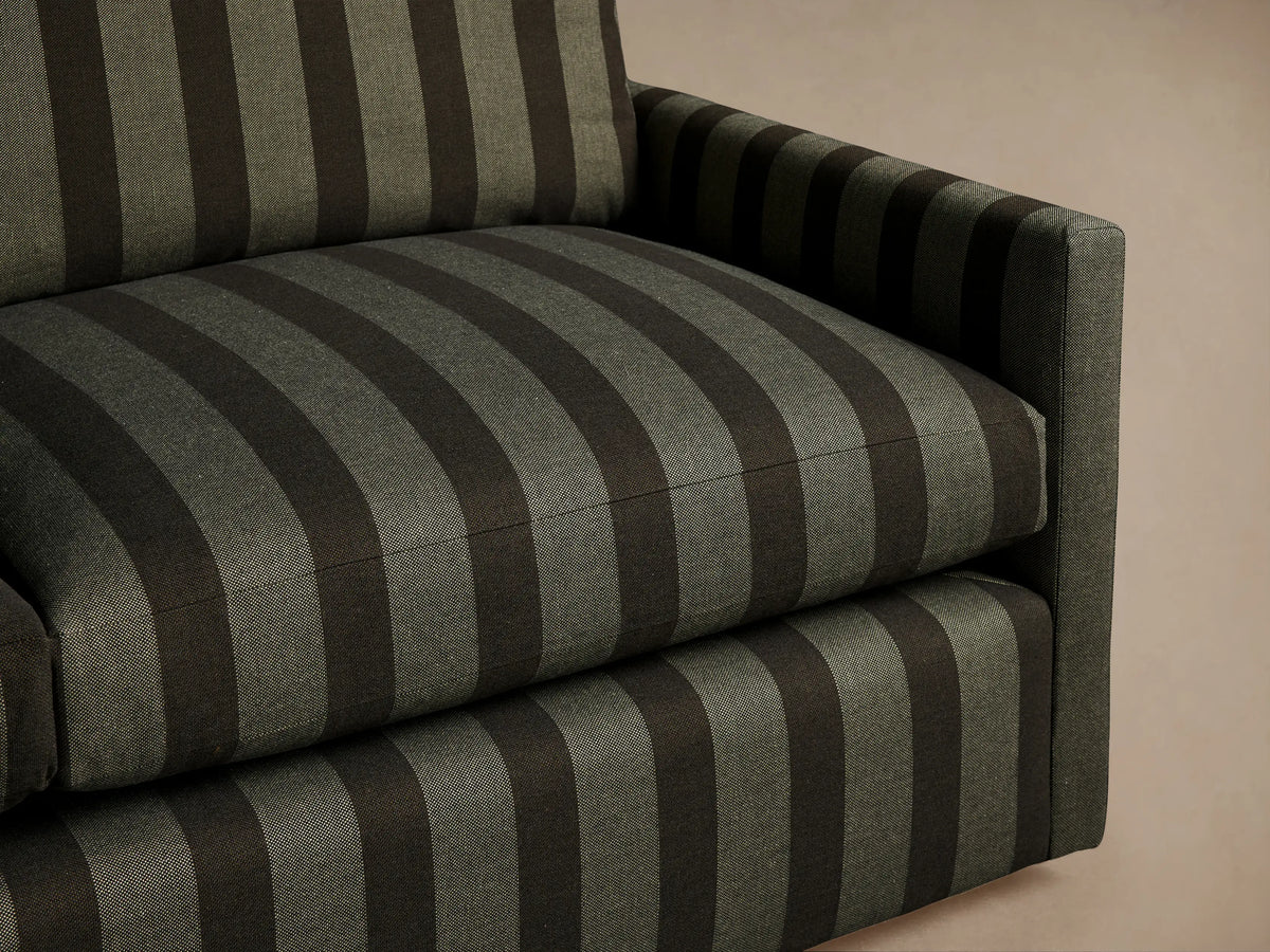 Kipton Slim Arm Three-Seat Sofa with vertical stripes in dark olive green and very dark green, front view.
