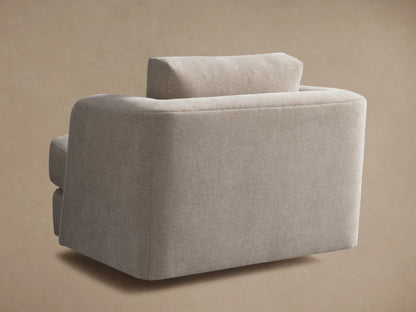 Beige Kayden Swivel Chair with soft fabric upholstery, featuring a plush seat and backrest, rounded armrests, and a sturdy build.