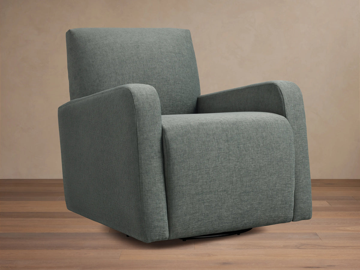 Gray upholstered Kershaw Swivel Chair with soft, textured fabric. Features wide armrests, a high backrest, and a concealed swivel base.