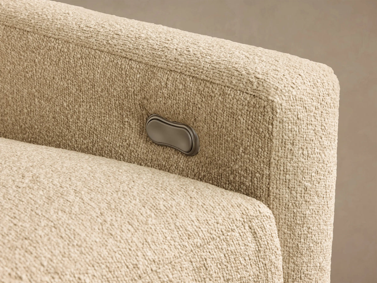Front view of the light beige Kipton Slope Arm Three-Piece Motion Chaise Sectional with sloped arms and a left-facing chaise.