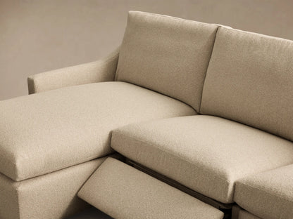 Close-up of the beige textured fabric and silver motion control button on the Kipton Slope Arm Three-Piece Motion Chaise Sectional.
