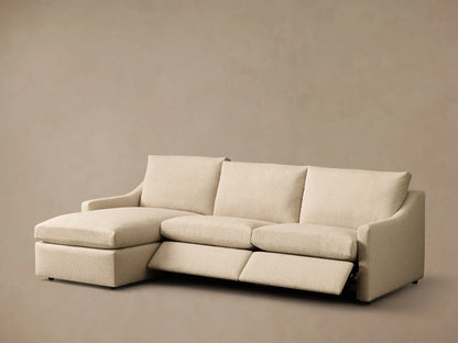 Rear view of the Beige Kipton Slope Arm Three-Piece Motion Chaise Sectional with three sections and plush back cushions.