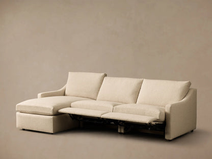 Front view of the cream Kipton Slope Arm Three-Piece Motion Chaise Sectional with two footrests extended.