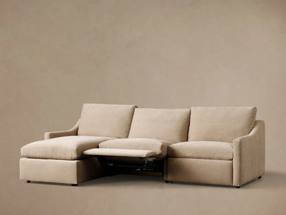 Rear view of the beige Kipton Slope Arm Three-Piece Motion Chaise Sectional.