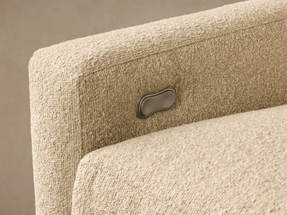 Close-up of the beige textured Kipton Slope Arm Three-Piece Motion Chaise Sectional, showing a silver motion control button.