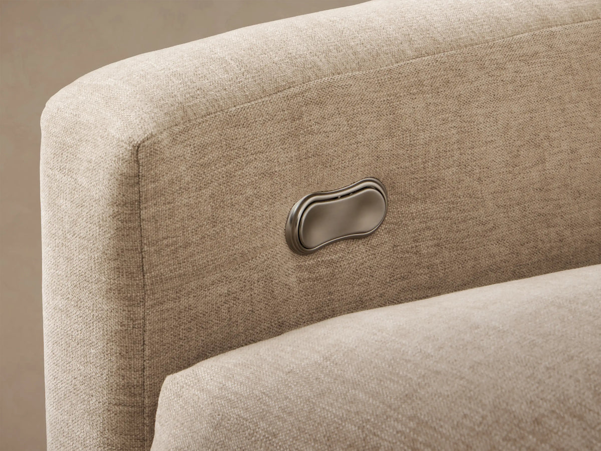 Front view of a light beige Kipton Slope Arm Three-Piece Motion Chaise Sectional, featuring recliners and a long chaise.