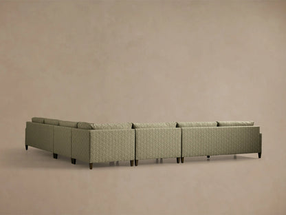 Front-angle view of the green Kipton Slim Arm Elevated Five-Piece Corner Sectional with slim arms and elevated mocha feet.