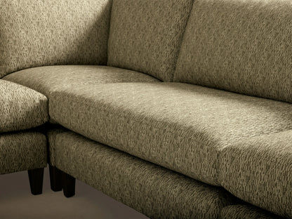 Rear view of the light green patterned fabric Kipton Slim Arm Elevated Five-Piece Corner Sectional with mocha finish feet.