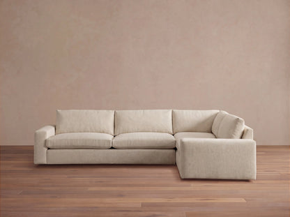 Front view of a light beige Kipton Wide Arm Two-Piece Sectional, L-shaped with wide arms and textured fabric upholstery.