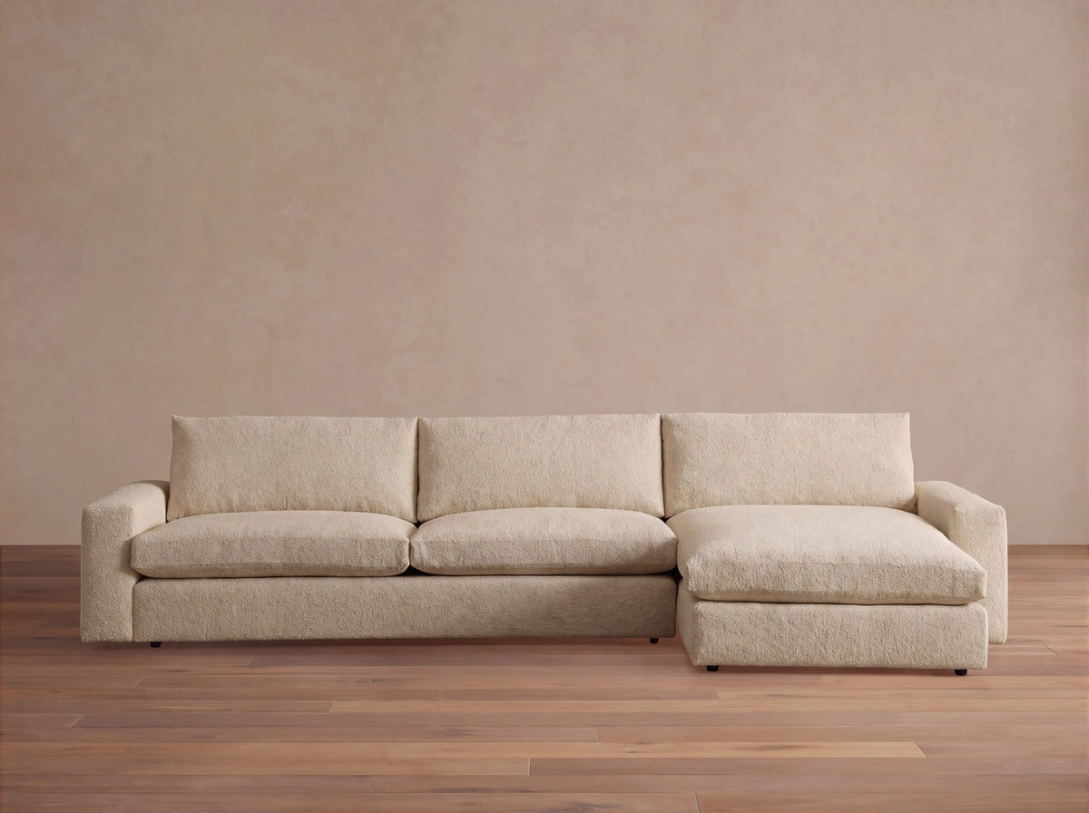 Light beige Kipton Wide Arm Two-Piece Chaise Sectional with a right-hand chaise and wide track arms, on white background.