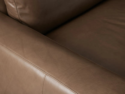 Kipton Wide Arm Leather Sofa, a modern, brown leather 2-seater with wide square arms, two seat cushions, and two back cushions.
