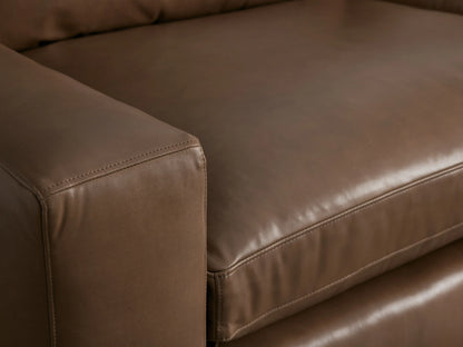 Front view of Kipton Wide Arm Leather Sofa in rich brown leather, with two soft cushions and wide square arms, on wood floor.