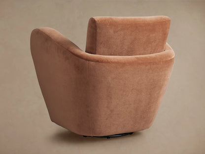 Close-up, angled view of Amelia Swivel Chair's plush mocha velvet back and armrest, showing soft curves.