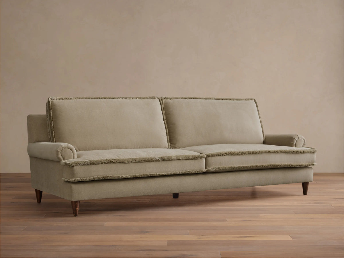 Front view of the beige McKinley Sofa with rolled arms and frayed trim, featuring two back and seat cushions.