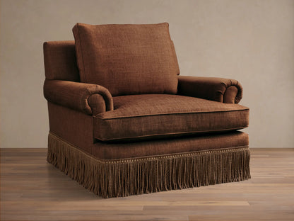 Front view of a brown McKinley Chair with Fringe, featuring rolled arms and a decorative fringed skirt.