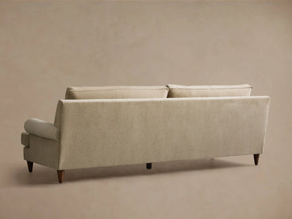 Front view of the oatmeal McKinley Sofa, featuring two large seat cushions, two plush back cushions, rolled arms, and dark wooden legs.