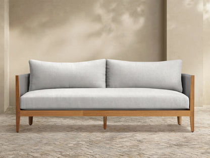 Front view of the Newport Outdoor Sofa with light grey cushions, natural teak frame, and grey woven rope armrests.