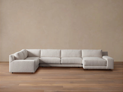 Novoli Four-Piece Chaise Sectional in textured light beige fabric, L-shaped with a right-facing chaise on a wood floor.