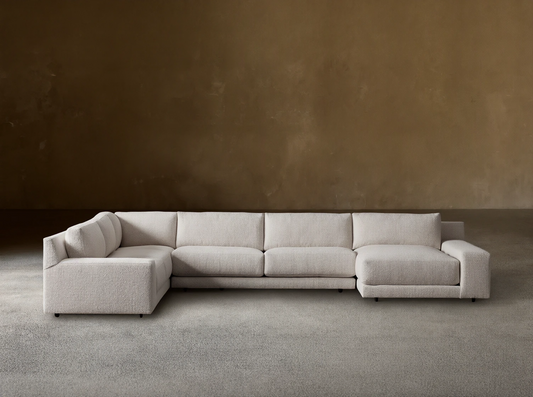 Novoli Four-Piece Chaise Sectional in textured light beige fabric, L-shaped with a right-facing chaise on a wood floor.