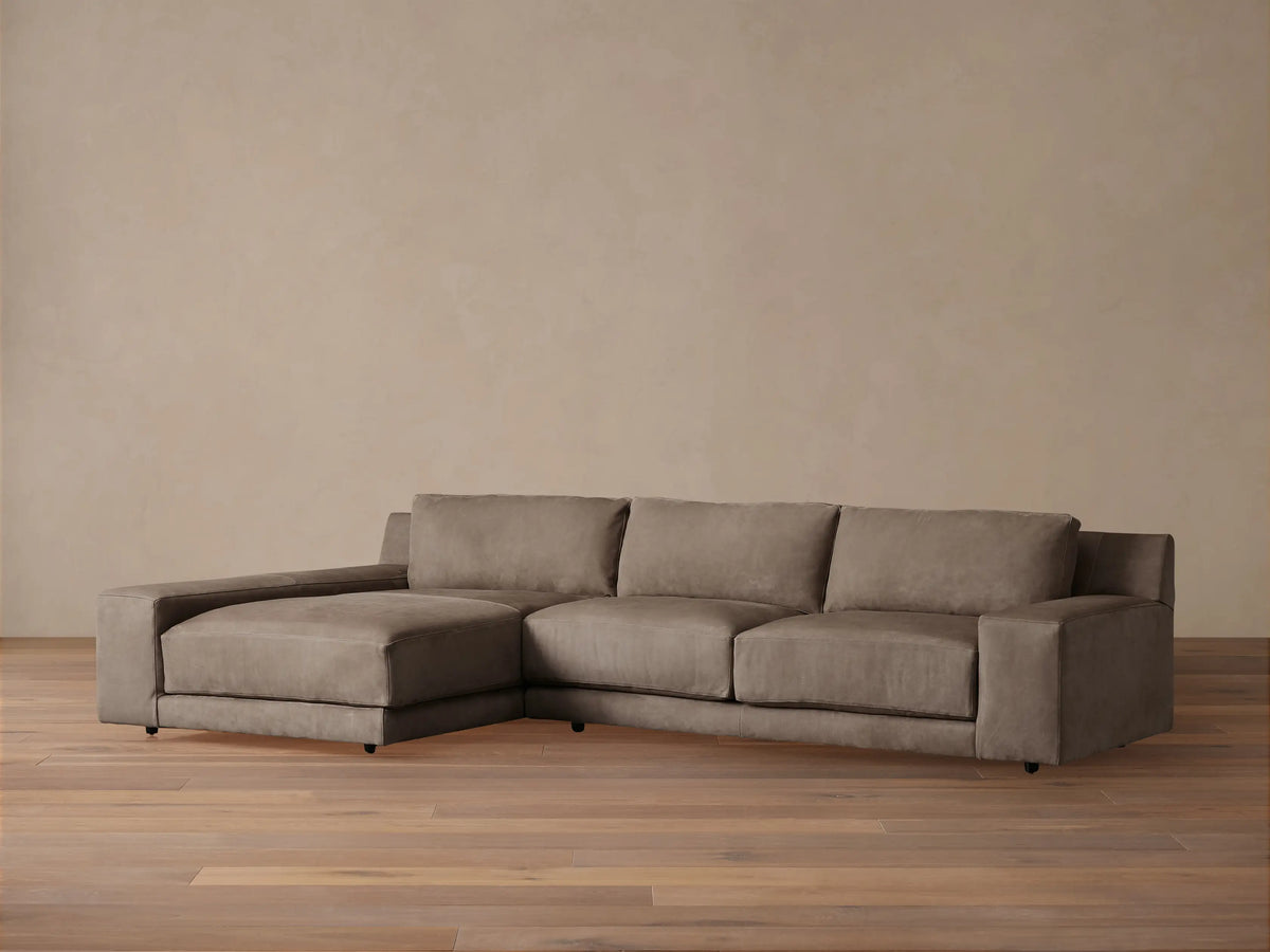 Novoli Nubuck Leather Two-Piece Chaise Sectional, muted taupe, with a left-facing chaise on a wood floor.