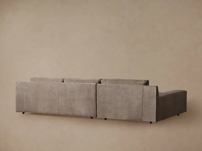 Novoli Nubuck Leather Two-Piece Chaise Sectional, close-up of warm brown nubuck leather, armrest, and back cushion with visible stitching.