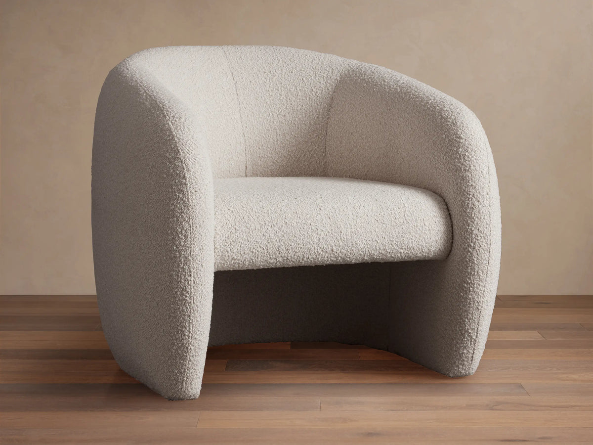 Fresno Floating Seat Chair, modern rounded barrel chair in light beige textured boucle fabric, with a floating seat design.
