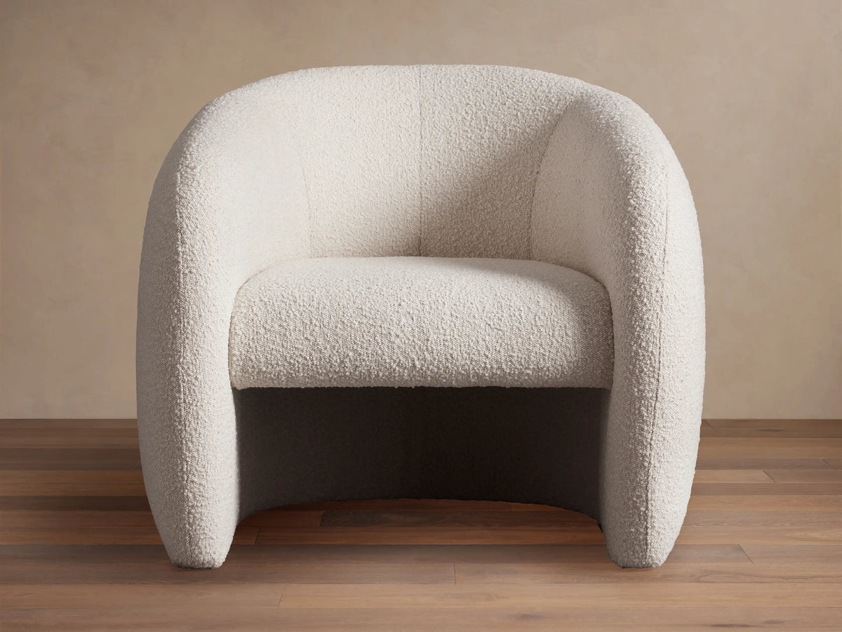Fresno Floating Seat Chair, modern rounded barrel chair in light beige textured boucle fabric, with a floating seat design.