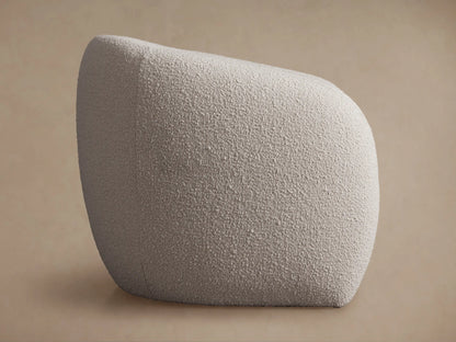 Fresno Floating Seat Chair: Cream, textured boucle fabric, rounded organic shape. Viewed from an elevated side angle on a neutral background.