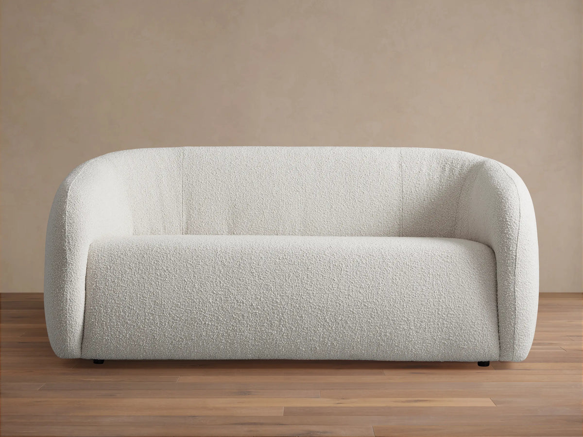Front view of the cream textured Fresno Sofa with rounded arms and back.