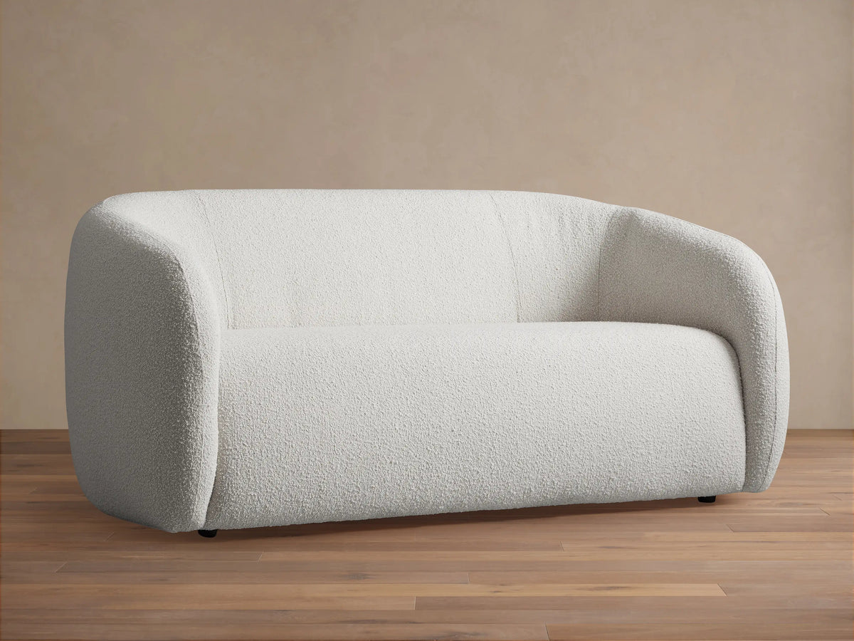 Front view of the cream textured Fresno Sofa with rounded arms and back.