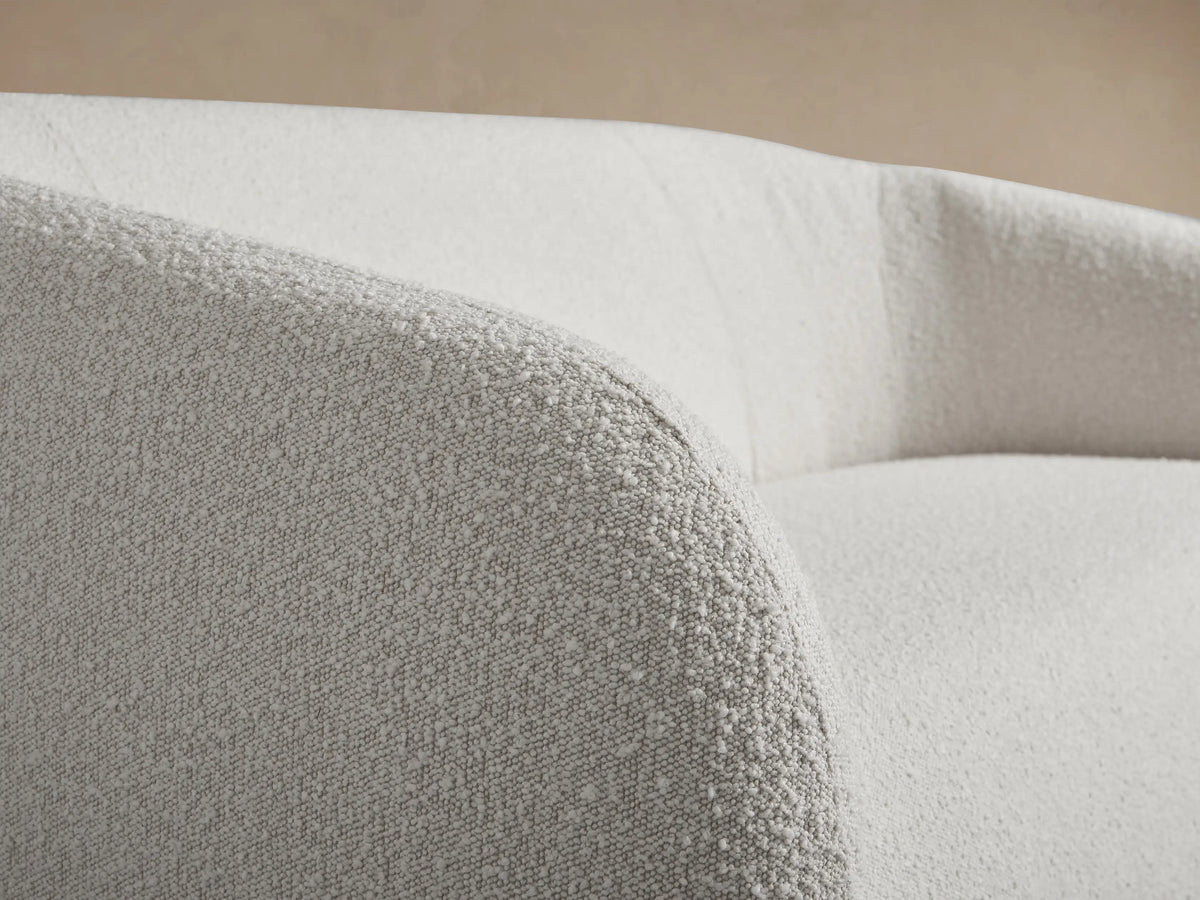 Front view of the white textured Fresno Sofa with rounded arms and a seamless, curved back.