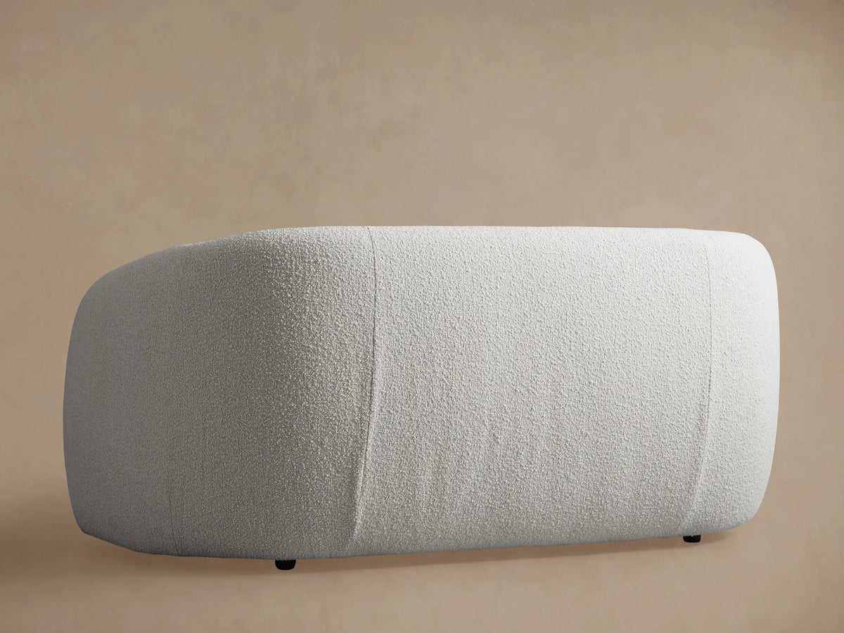 Close-up of the off-white textured fabric on the arm and back of the Fresno Sofa.