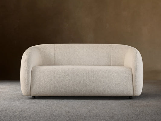 Front view of the cream textured Fresno Sofa with rounded arms and back.