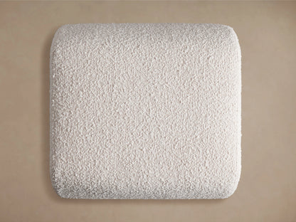 Fresno Ottoman with textured light gray fabric, showcasing a smooth, rounded corner against a soft beige background.