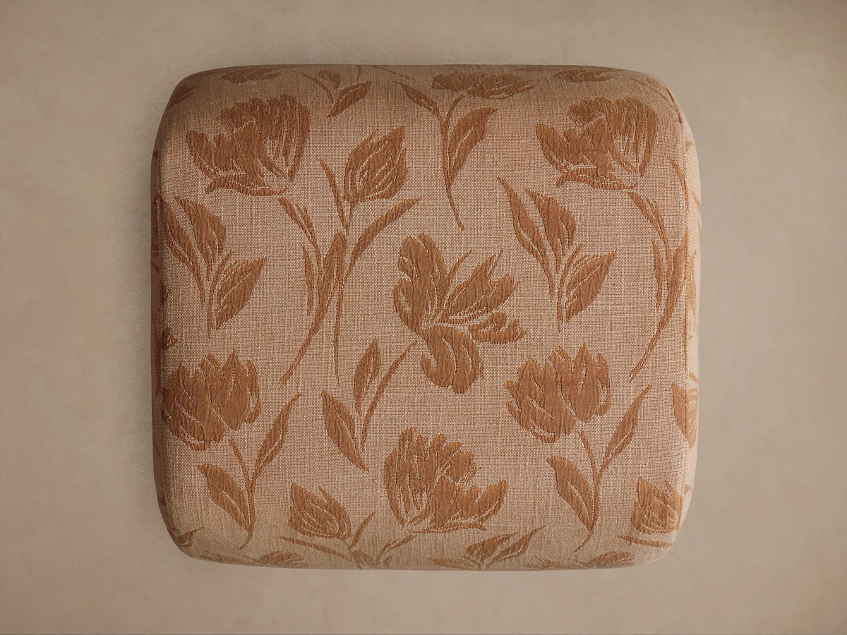 Close-up of Fresno Ottoman's light tan woven fabric with a darker brown, textured botanical leaf and floral pattern.