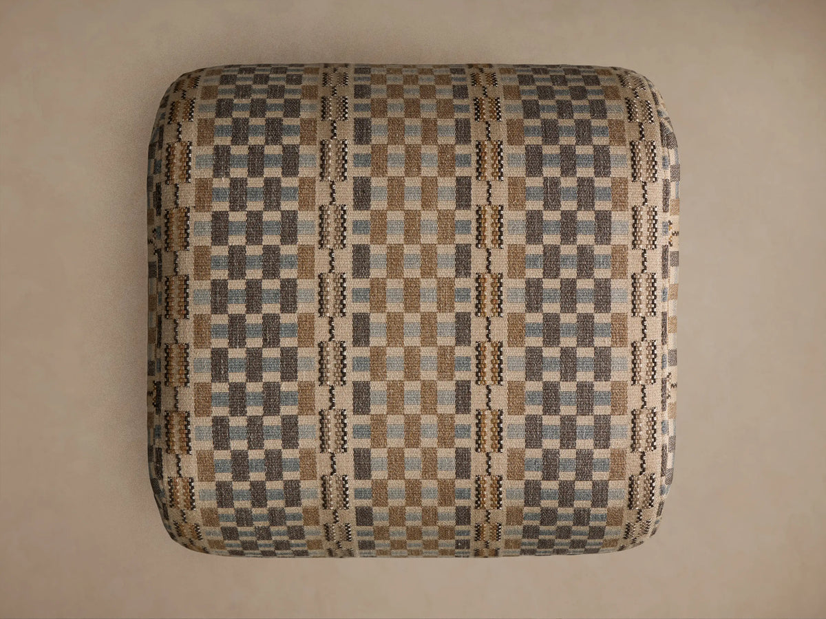 Fresno Ottoman, close-up. Textured woven fabric with checkerboard pattern in beige, brown, and pale blue with vertical stripes.