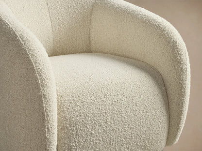Close-up of the cream textured fabric on the curved arm and seat of the Fresno Swivel Glider.