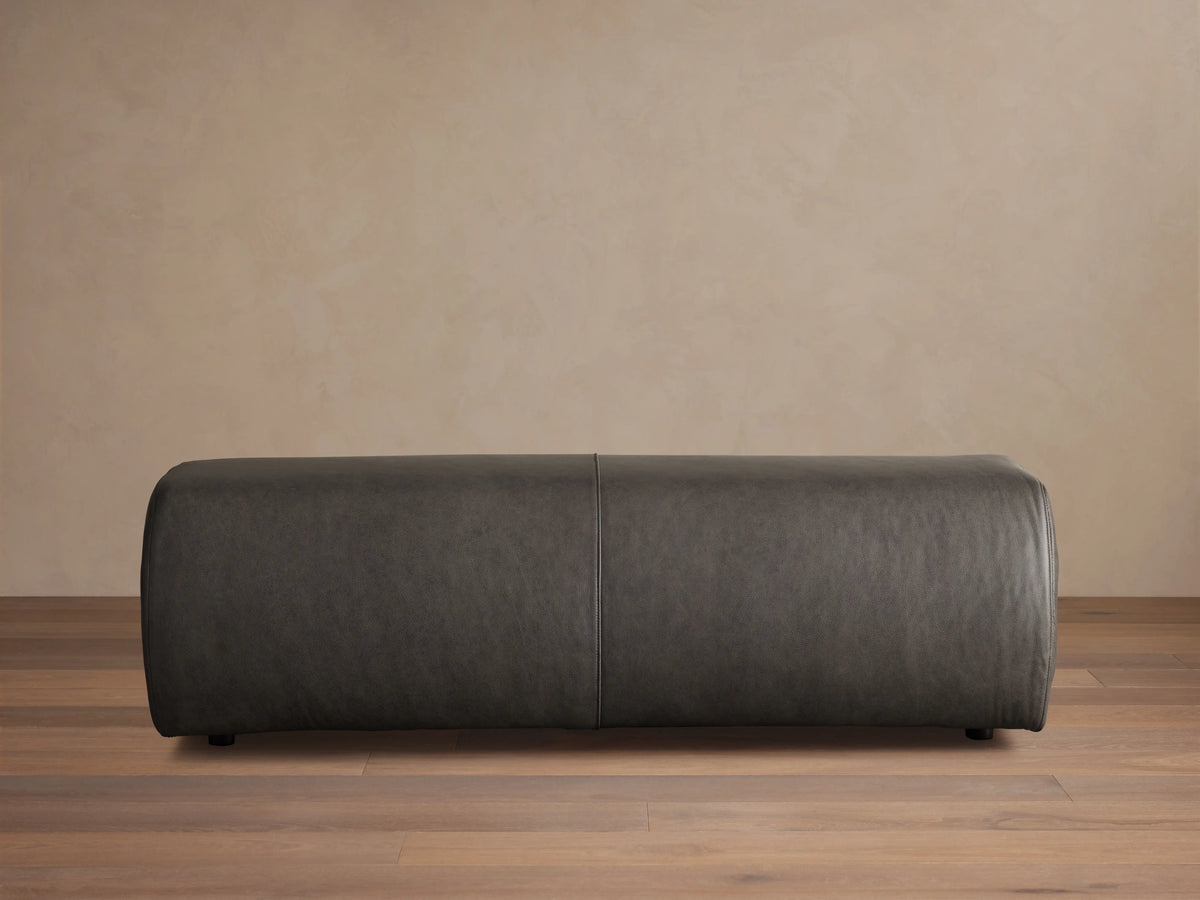 Fresno Leather Bench in dark brown leather, rectangular shape, smooth finish, positioned against a neutral wall on wooden floor.