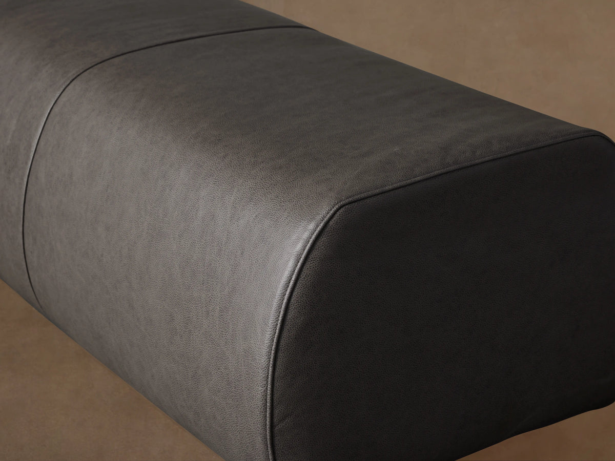 Fresno Leather Bench in dark brown leather, rectangular shape, smooth finish, positioned against a neutral wall on wooden floor.