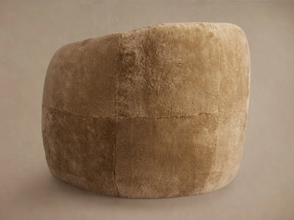 Fresno Leather Floating Seat Chair in brown plush fabric, showcasing its curved armrests, seat cushion, and soft texture.