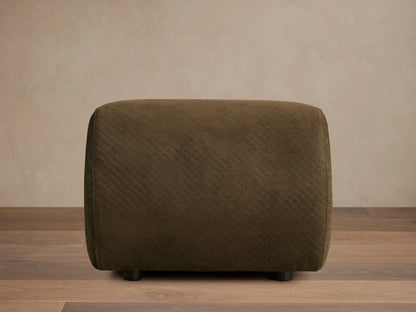 Front view of the dark olive green quilted Fresno Leather Ottoman with small dark feet.