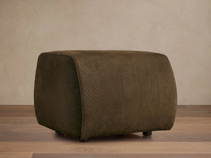 Front view of the dark olive green quilted Fresno Leather Ottoman with small dark feet.