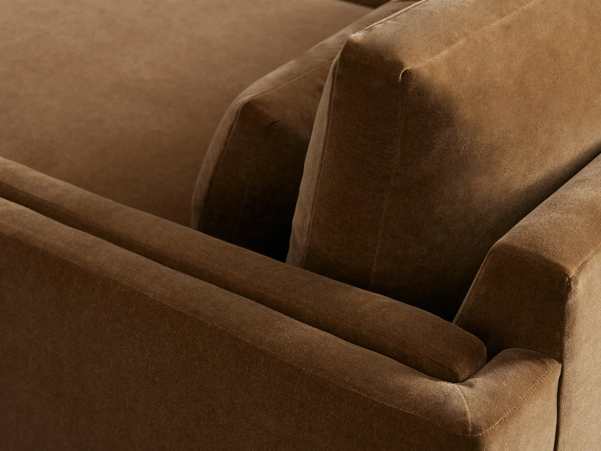 Sumner three-piece sectional with two chaise lounges in brown fabric, back cushions, and metal legs on wood floor in a beige room.