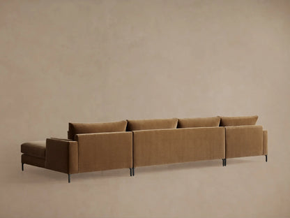 Brown upholstered Sumner Three-Piece Double Chaise Sectional, close-up of smooth fabric, showing seat cushion and backrest detail.