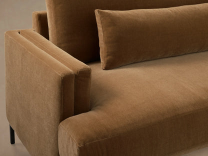 Close-up of the brown Sumner Sofa, highlighting the plush armrest, deep seat cushion, and soft back pillow.