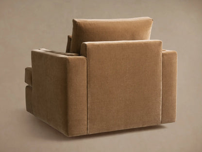 Sumner Swivel Chair in brown fabric, side view showing its square form, plush cushions, and modern design against a neutral background.