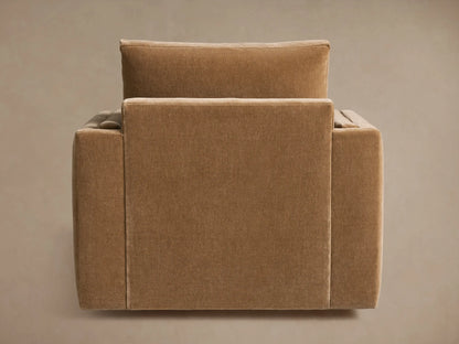 Sumner Swivel Chair in neutral brown fabric, showing the back and side views. Features boxy cushions and a solid swivel base.